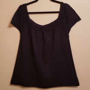 Navy knit top with crochet neckline